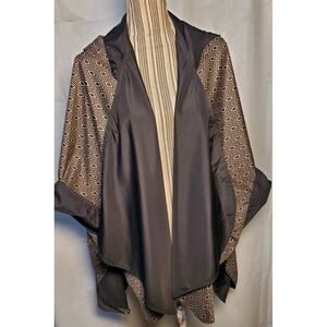 RainCaper Reversible Hooded Rain Poncho Solid black Side 1 Geometric Side 2